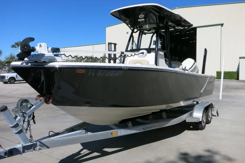Slide: The Image of 2019 Sea Born LX22 Center Console boat on trailer, parked outdoors. - 26