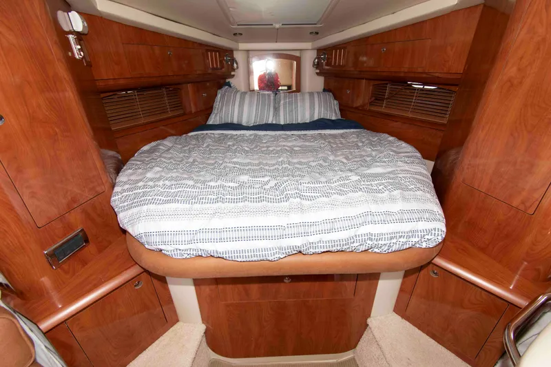Slide: The Image of Luxurious cabin interior of 2007 Four Winns 358 Vista yacht with cozy bedding. - 10
