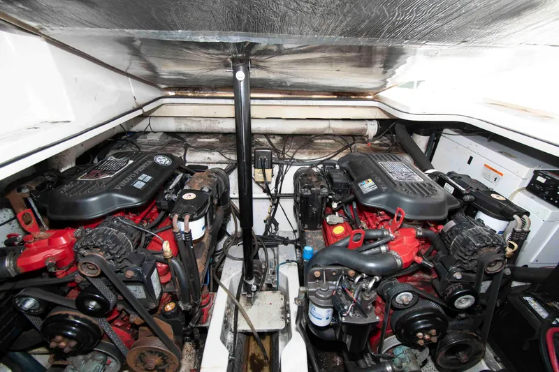 Slide: The Image of Engine compartment of a 2007 Four Winns 358 Vista boat, featuring dual Volvo Penta engines. - 13