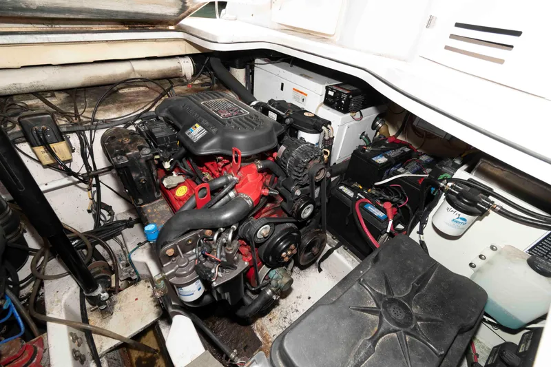 Slide: The Image of Engine compartment of a 2007 Four Winns 358 Vista boat, showcasing mechanical components. - 14