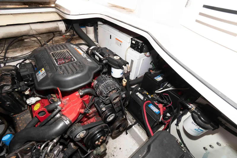 Slide: The Image of Engine compartment of 2007 Four Winns 358 Vista boat, featuring Volvo Penta engine and batteries. - 15