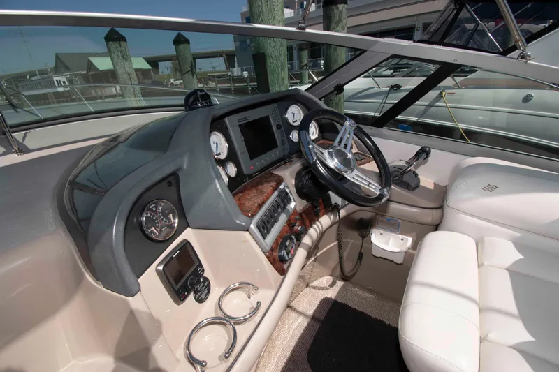 Slide: The Image of 2007 Four Winns 358 Vista boat cockpit with steering wheel and control panel. - 3