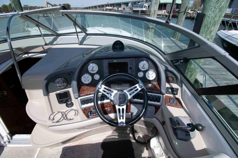 Slide: The Image of 2007 Four Winns 358 Vista boat helm with steering wheel and instrument panel. - 4