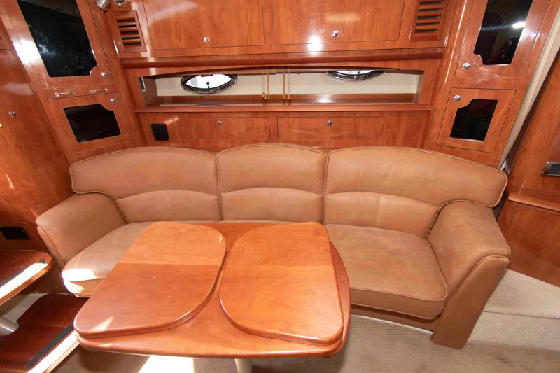 Slide: The Image of Luxurious interior of 2007 Four Winns 358 Vista yacht with leather seating and wooden cabinetry. - 8