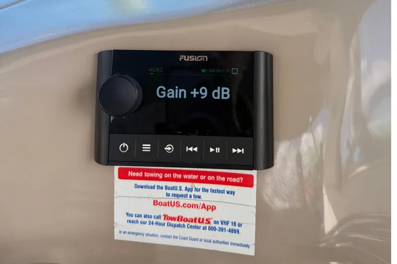 Slide: The Image of Fusion audio control panel on 1999 Sea Ray 410 Express Cruiser, displaying gain adjustment. - 10