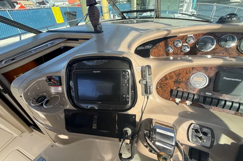 Slide: The Image of 1999 Sea Ray 410 Express Cruiser dashboard with navigation equipment and controls. - 8