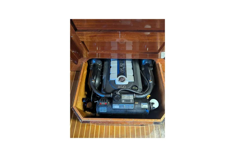 Slide: The Image of 1973 Lyman Islander boat engine compartment with 6.2L V8 engine. - 19