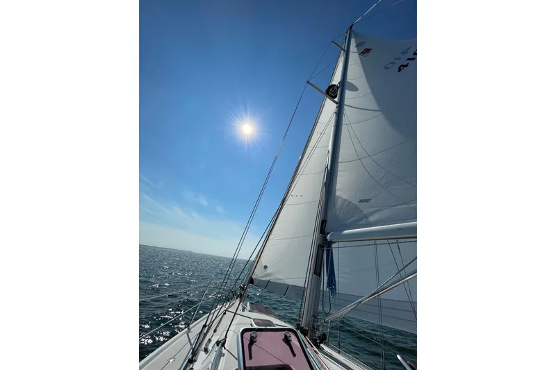 Slide: The Image of Sailing on a 2004 Catalina 350 under a bright sunlit sky. - 12