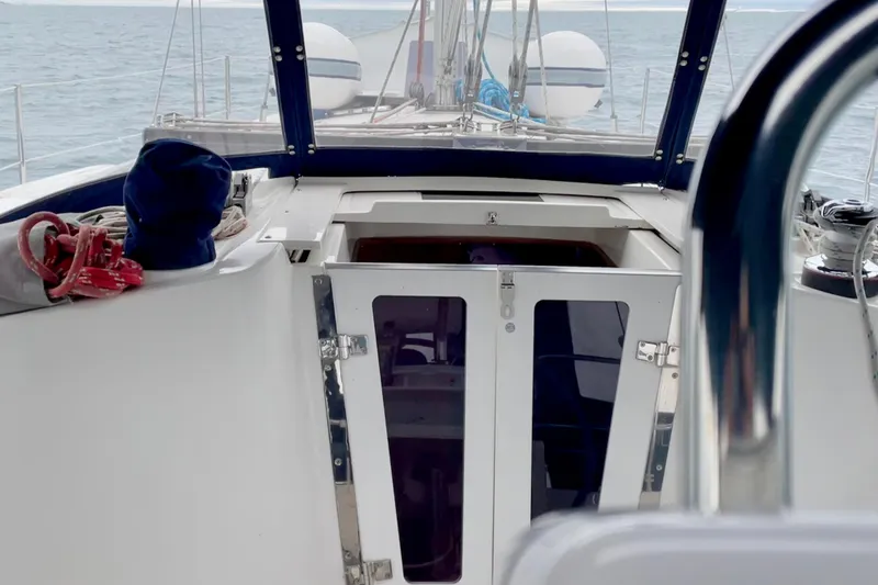 Slide: The Image of Cockpit view of 2004 Catalina 350 sailboat with ocean backdrop. - 16