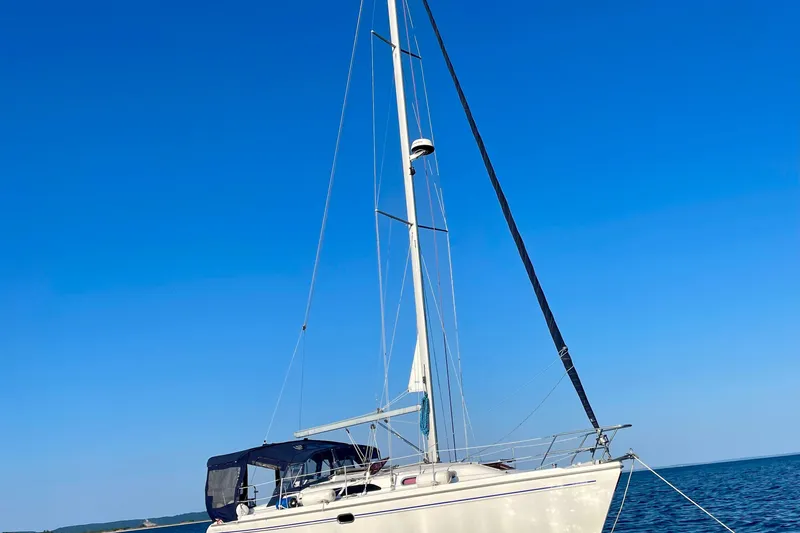 Slide: The Image of Sailboat Catalina 350, 2004 model, anchored on calm blue sea under clear sky. - 5