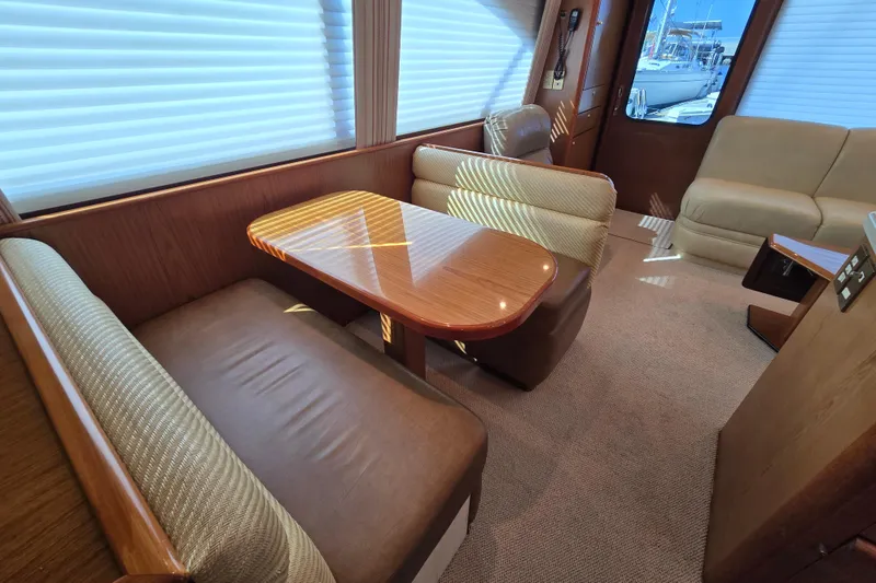 Slide: The Image of Luxurious interior of 2007 Ocean Yachts 46 Super Sport with elegant seating and table. - 18
