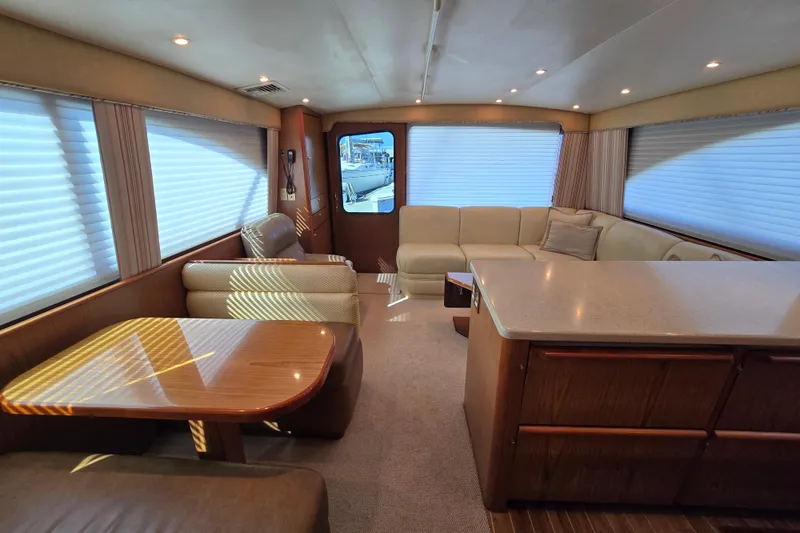 Slide: The Image of Luxurious interior of 2007 Ocean Yachts 46 Super Sport with elegant seating and dining area. - 19