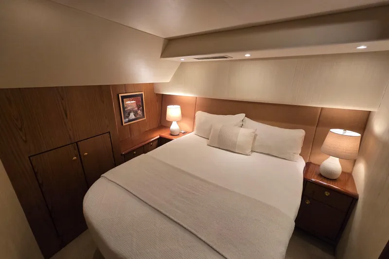 Slide: The Image of Luxurious bedroom interior of 2007 Ocean Yachts 46 Super Sport with cozy lighting. - 25