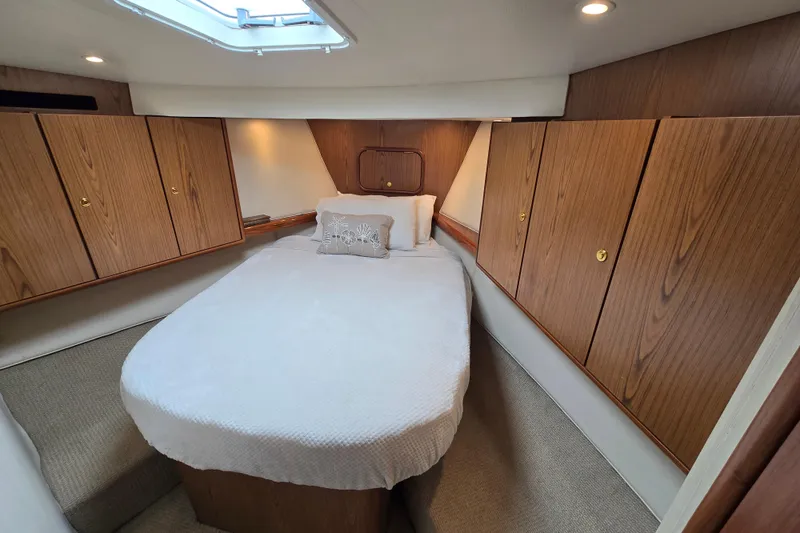 Slide: The Image of Luxurious cabin interior of 2007 Ocean Yachts 46 Super Sport with wood paneling. - 31