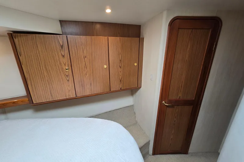 Slide: The Image of 2007 Ocean Yachts 46 Super Sport cabin with wooden cabinets and door. - 34