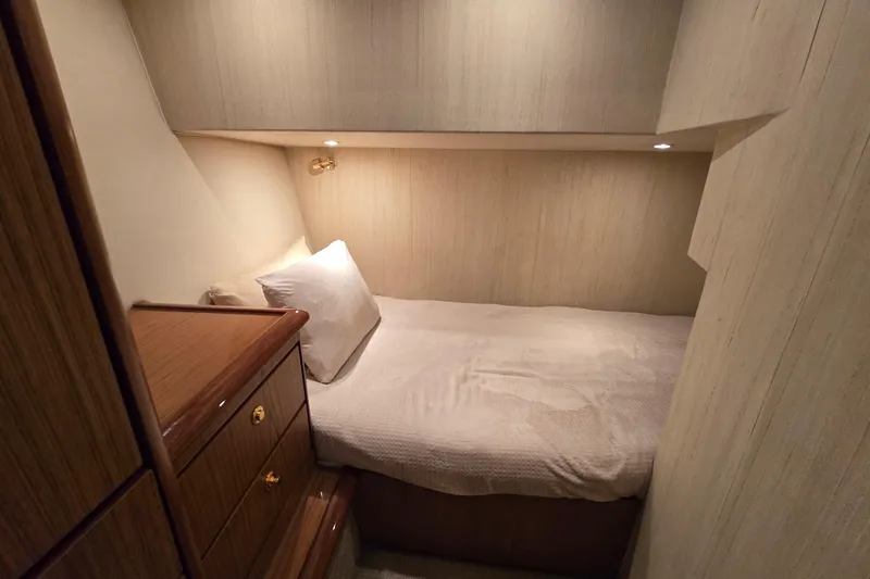 Slide: The Image of 2007 Ocean Yachts 46 Super Sport cabin with cozy bed and wooden cabinetry. - 37