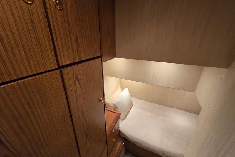 Slide: The Image of Cozy cabin interior of 2007 Ocean Yachts 46 Super Sport with wooden cabinetry. - 38