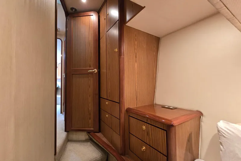 Slide: The Image of Interior of 2007 Ocean Yachts 46 Super Sport, featuring wooden cabinetry and cozy design. - 40