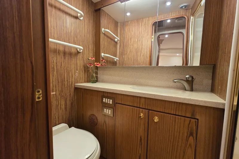 Slide: The Image of Luxurious bathroom in 2007 Ocean Yachts 46 Super Sport with wood finish and modern fixtures. - 42