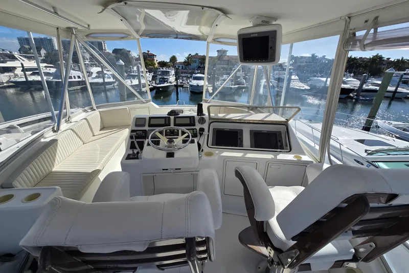 Slide: The Image of Luxurious 2007 Ocean Yachts 46 Super Sport cockpit with marina view. - 48