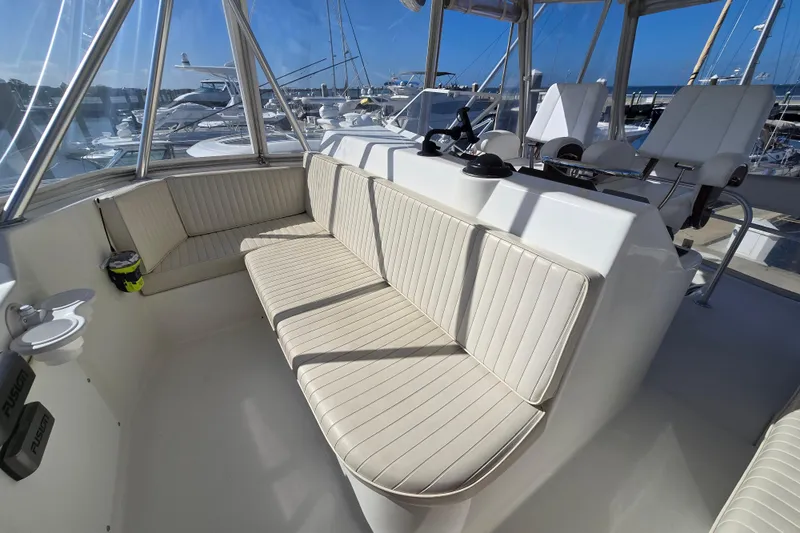 Slide: The Image of 2007 Ocean Yachts 46 Super Sport interior with cushioned seating and helm station. - 50