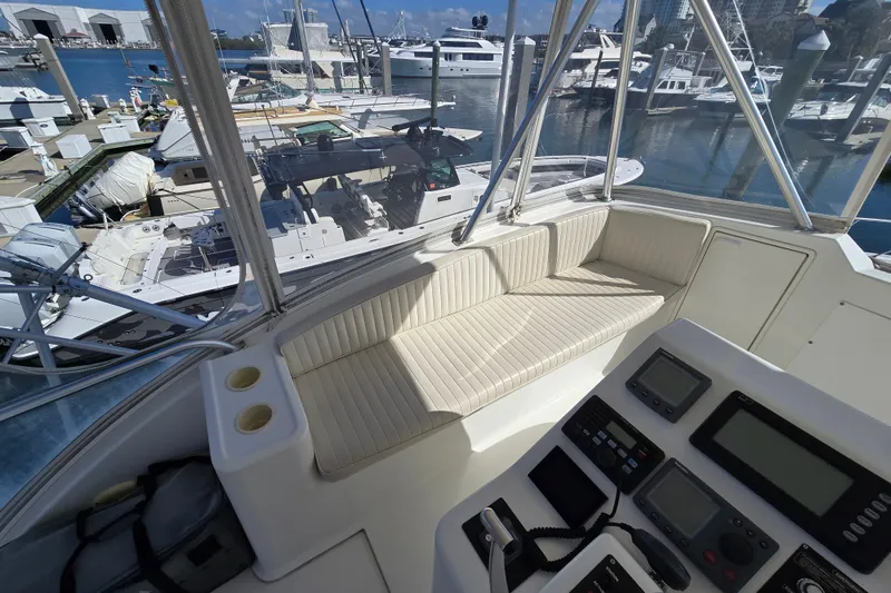 Slide: The Image of 2007 Ocean Yachts 46 Super Sport cockpit with seating and control panel, docked at marina. - 51