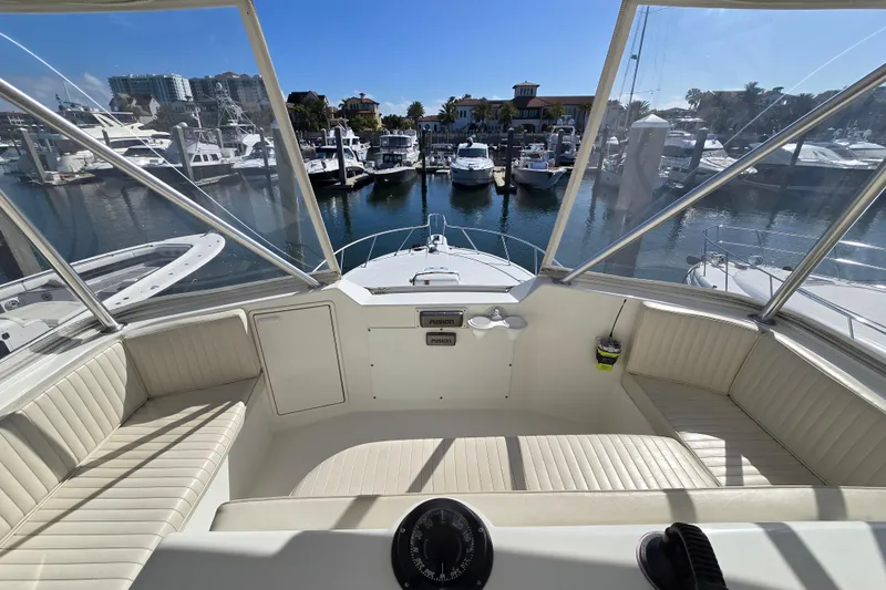 Slide: The Image of 2007 Ocean Yachts 46 Super Sport cockpit view, marina backdrop, sunny day. - 52