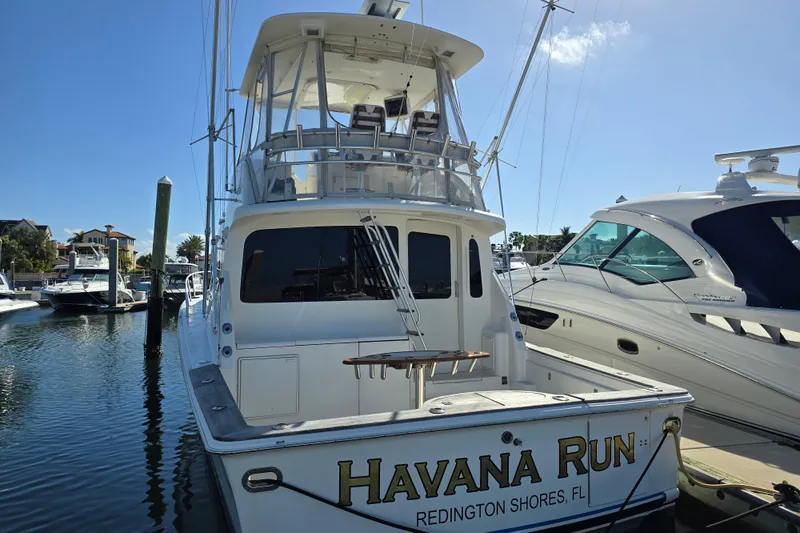 Slide: The Image of 2007 Ocean Yachts 46 Super Sport docked, rear view, sunny marina setting. - 55
