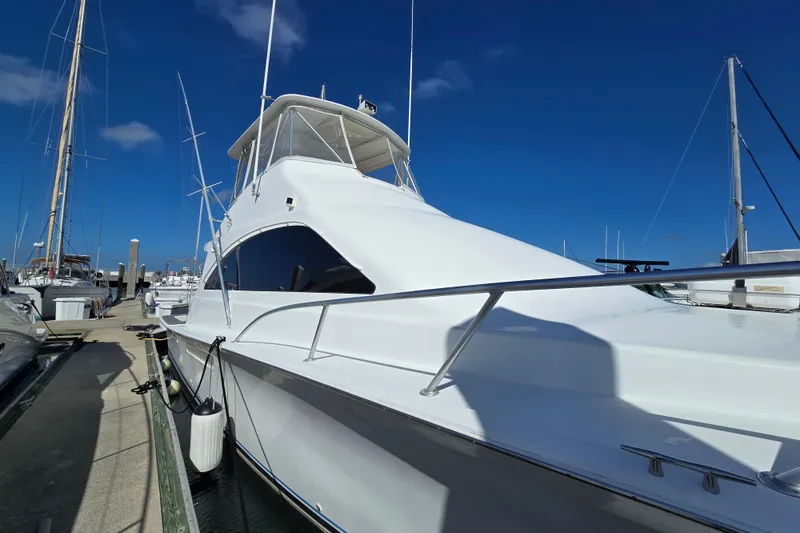 Slide: The Image of 2007 Ocean Yachts 46 Super Sport docked under clear blue sky. - 56
