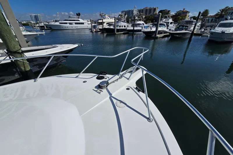 Slide: The Image of Bow view of 2007 Ocean Yachts 46 Super Sport in a marina setting. - 57