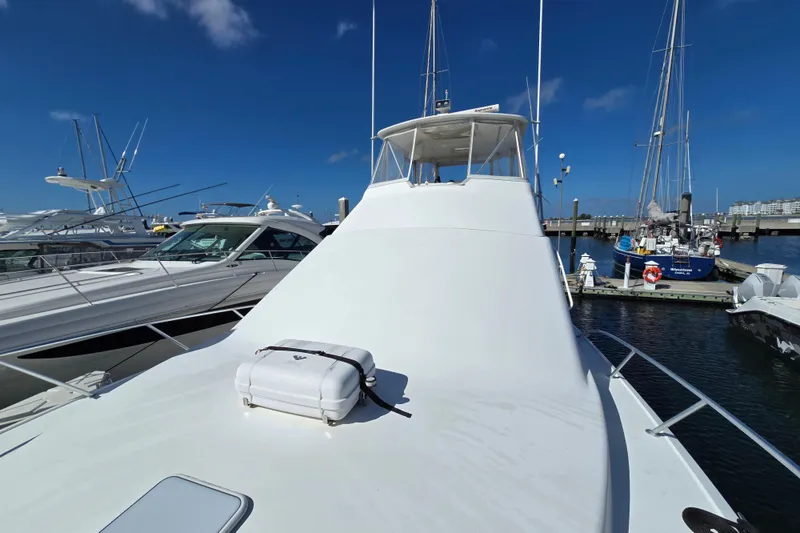 Slide: The Image of 2007 Ocean Yachts 46 Super Sport docked at marina under clear blue sky. - 58