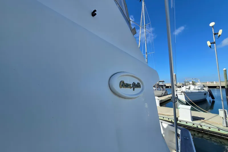 Slide: The Image of 2007 Ocean Yachts 46 Super Sport docked at marina under clear blue sky. - 59