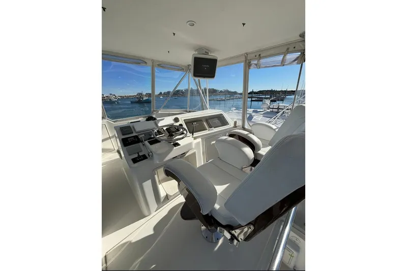 Slide: The Image of 2007 Ocean Yachts 46 Super Sport on calm water near city. - 6