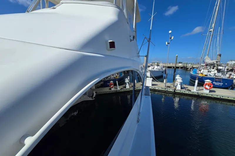 Slide: The Image of 2007 Ocean Yachts 46 Super Sport docked at a marina under clear blue skies. - 60