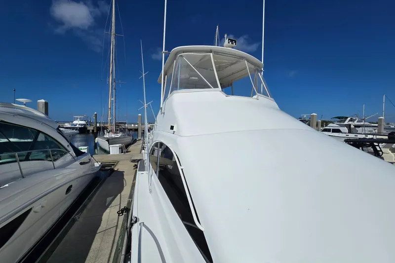 Slide: The Image of 2007 Ocean Yachts 46 Super Sport docked at marina under clear blue sky. - 61