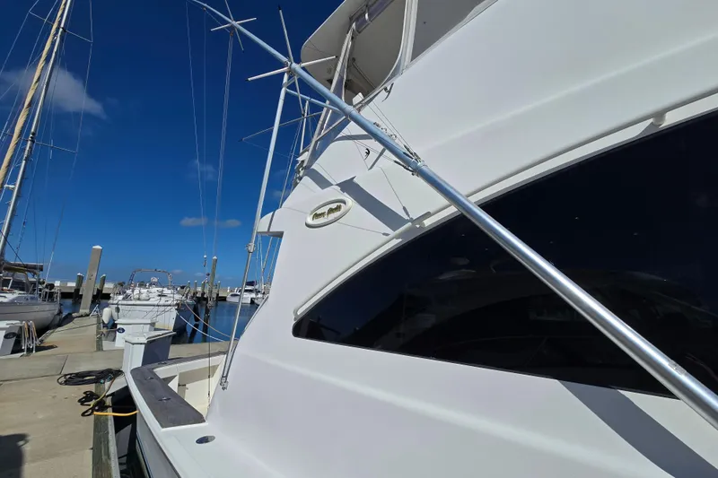 Slide: The Image of 2007 Ocean Yachts 46 Super Sport docked at marina under clear blue sky. - 62