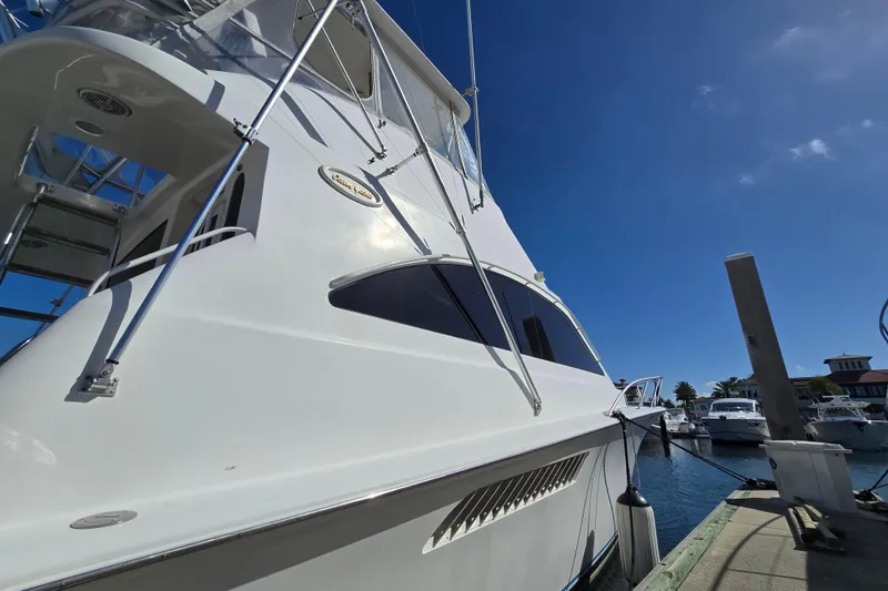 Slide: The Image of 2007 Ocean Yachts 46 Super Sport docked under clear blue sky. - 63