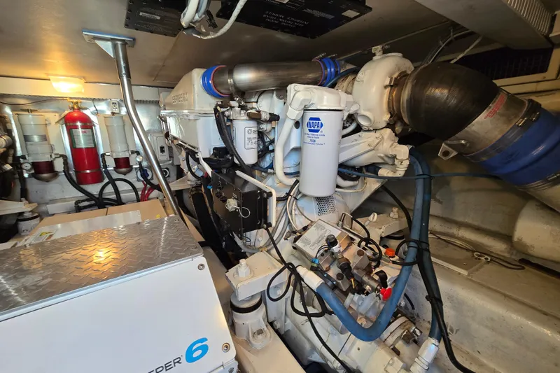 Slide: The Image of Engine room of 2007 Ocean Yachts 46 Super Sport, showcasing machinery and components. - 67