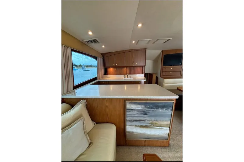 Slide: The Image of 2007 Ocean Yachts 46 Super Sport helm with panoramic marina view. - 7