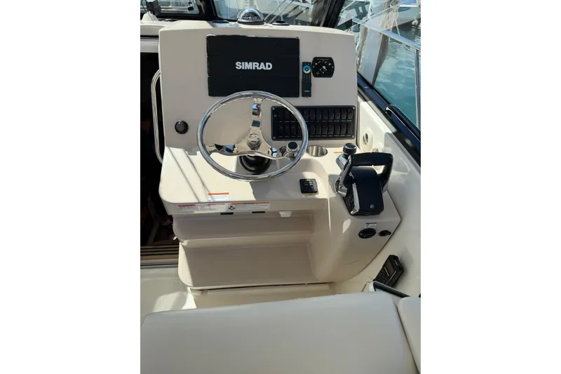 Slide: The Image of 2023 Boston Whaler 345 Conquest helm with Simrad navigation system. - 10