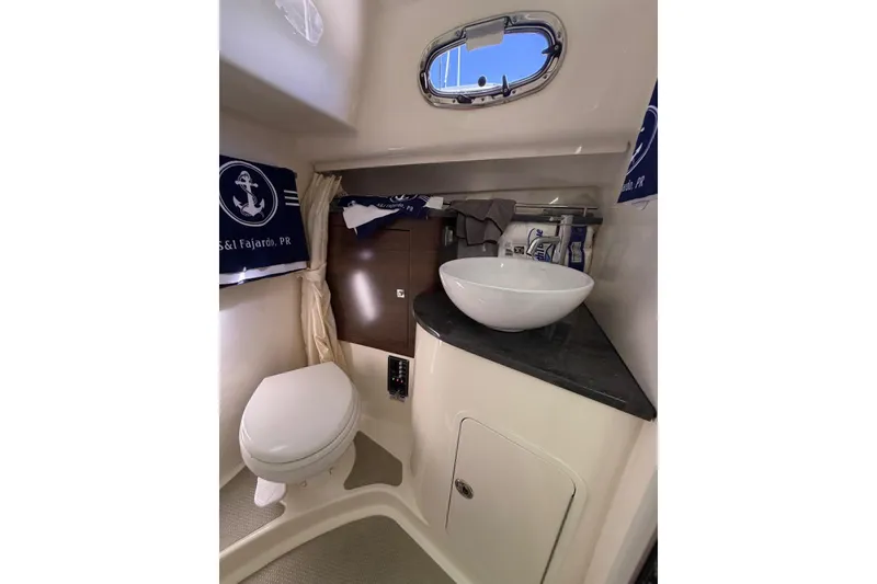 Slide: The Image of 2023 Boston Whaler 345 Conquest bathroom with modern sink and toilet. - 15