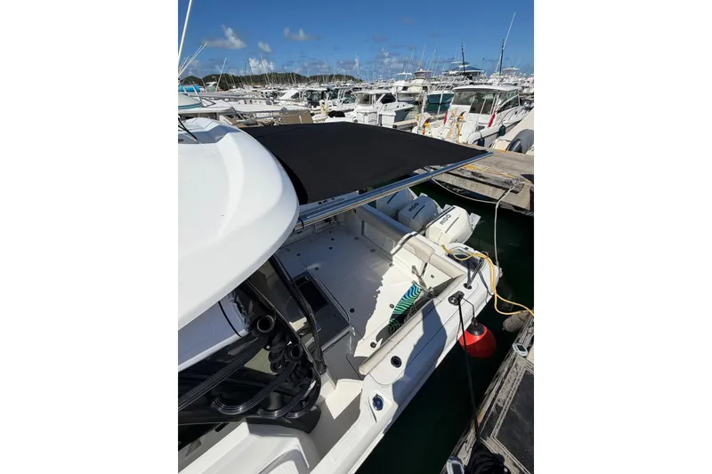 Slide: The Image of 2023 Boston Whaler 345 Conquest docked at marina, featuring sleek design and modern amenities. - 16