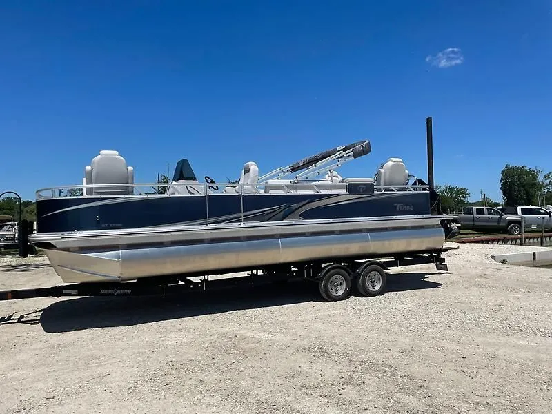 Slide: The Image of 2022 Tahoe GT 2585 CCF Tritoon on trailer, blue sky. - 5