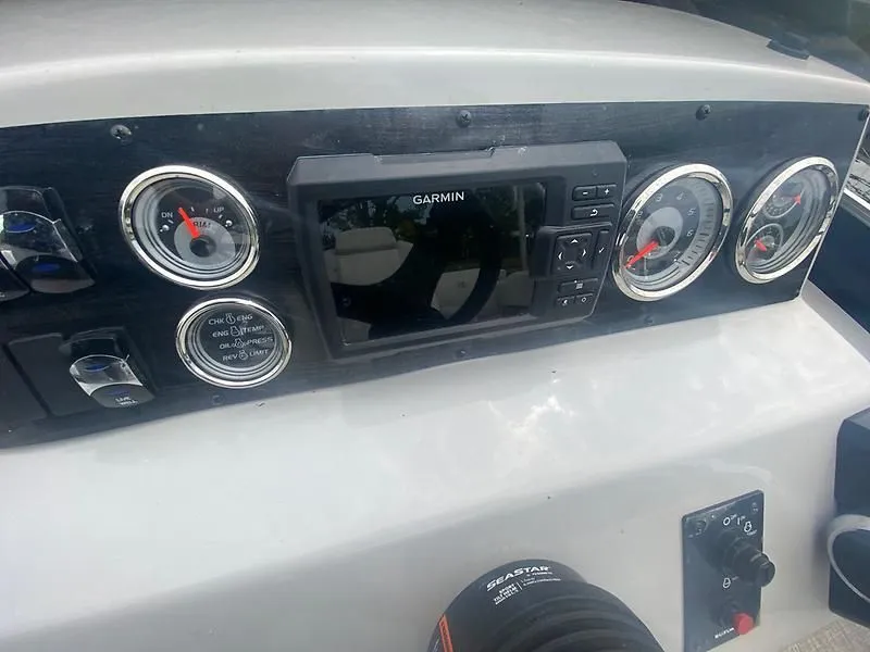 Slide: The Image of Dashboard of 2022 Tahoe GT 2585 CCF Tritoon with Garmin display. - 7