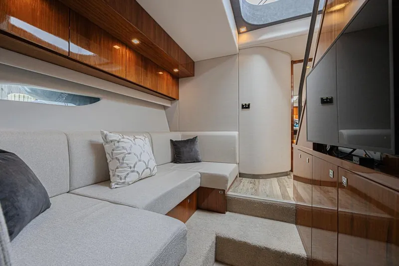 Slide: The Image of Luxurious interior of 2021 Riviera 6000 Sport Yacht Platinum Edition with elegant seating and modern design. - 17
