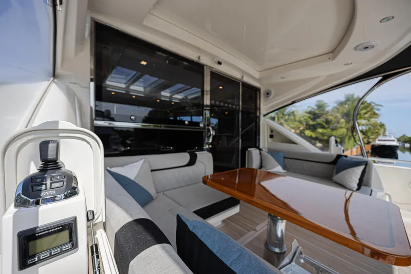 Slide: The Image of Luxurious interior of 2021 Riviera 6000 Sport Yacht Platinum Edition with plush seating and sleek design. - 9