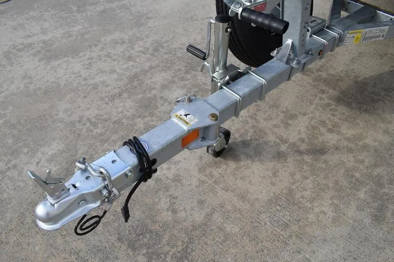 Slide: The Image of Trailer hitch of 2026 Lowe Roughneck RX1860 Tunnel Jet on concrete surface. - 25