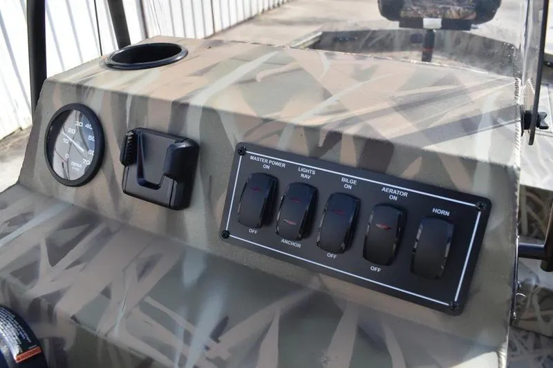 Slide: The Image of Control panel of 2026 Lowe Roughneck RX1860 Tunnel Jet boat with camouflage design. - 27