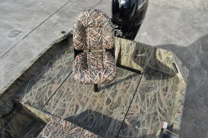 Slide: The Image of 2026 Lowe Roughneck RX1860 Tunnel Jet boat with camouflage seating and powerful outboard motor. - 28