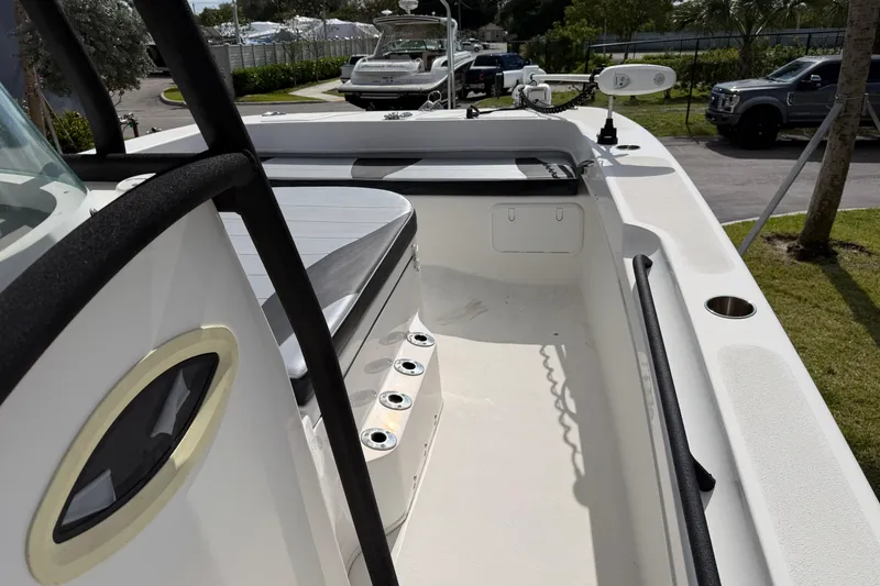 Slide: The Image of 2021 Twin Vee 310 CC GF boat interior with seating and rod holders. - 7